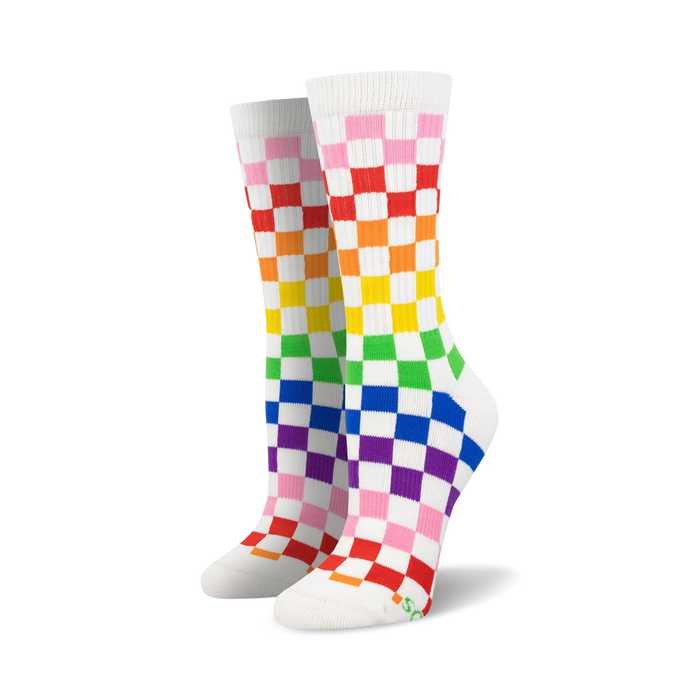Pair of rainbow checkered crew socks.  White background with pink, orange, yellow, green, blue, and purple squares. Fun and vibrant! }}
