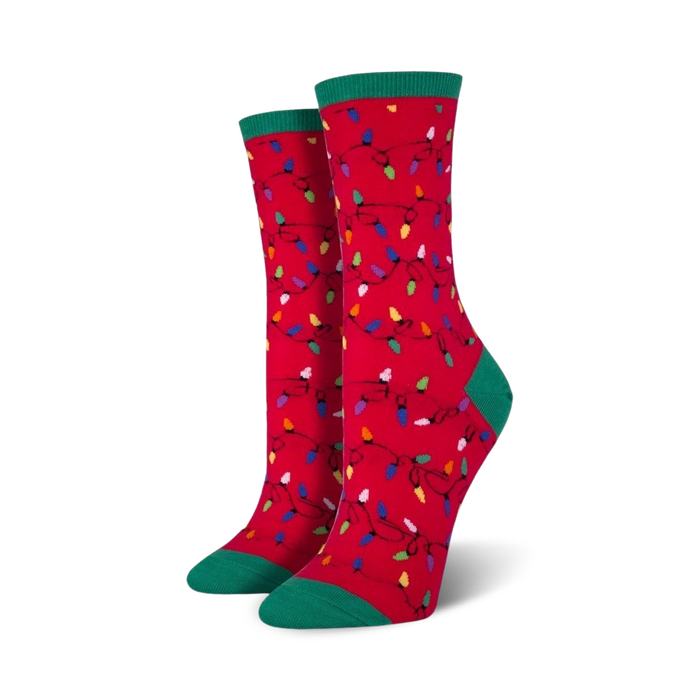 Pair of crew socks, red and green, featuring a whimsical pattern of colorful Christmas lights.