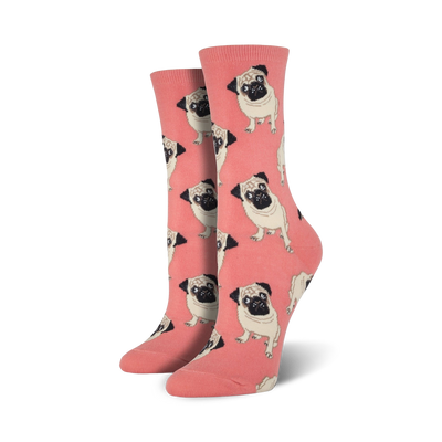Pair of crew socks; coral background with repeating pattern of light brown pugs; fun, quirky style.