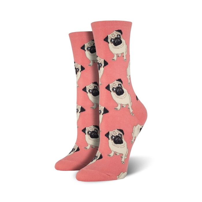 Pair of crew socks; coral background with repeating pattern of light brown pugs; fun, quirky style.