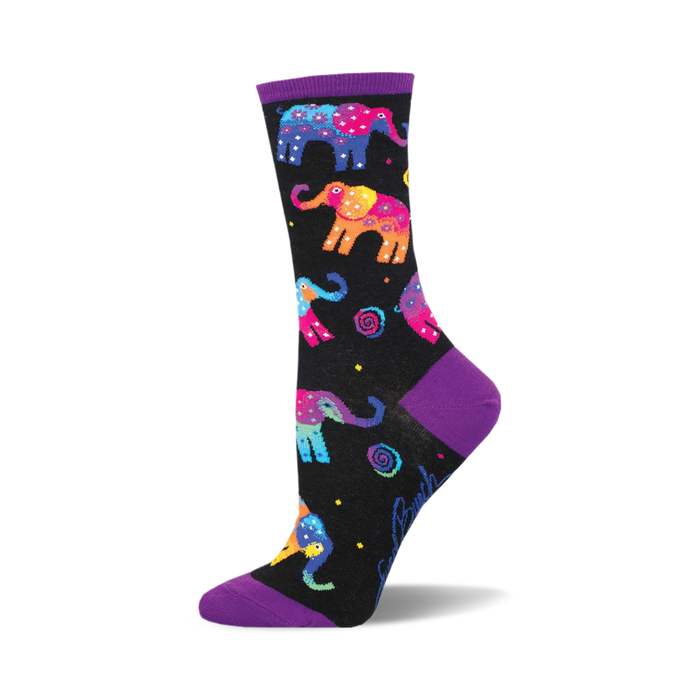 socks that are black with a pattern of multicolored elephants. the elephants have pink, blue, yellow, green, and orange colors. there are also some small white stars and yellow and white flowers in the background. the top of the sock is purple. }}