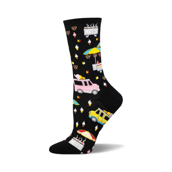 socks that are black with a pattern of colorful street food vendors. there are ice cream trucks, hot dog stands, and pretzel carts. the background is filled with small white dots. }}
