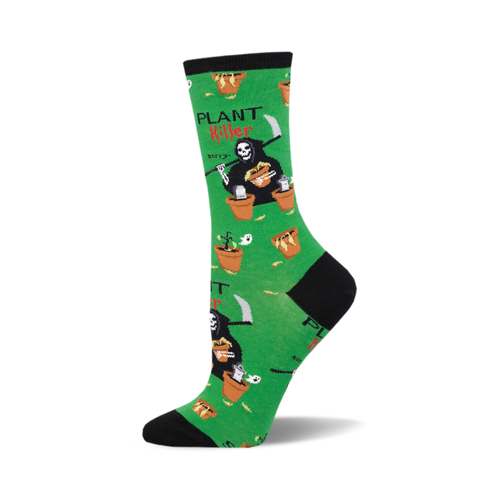 socks that are plant killer themed. they are green with a black toe and heel. the grim reaper is pictured on the socks with a plant in a pot. the grim reaper is wearing a black robe and a hood. the socks say 'plant killer' and 'sorry' in white text. }}