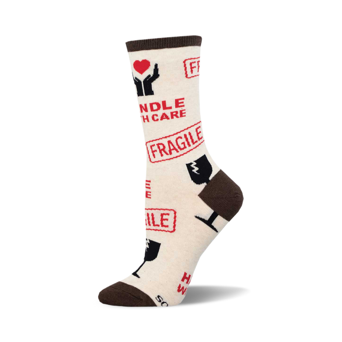 Cream crew socks with a brown cuff. The socks are covered in red 'Fragile' stamps and 'Handle With Care' text with related icons. }}