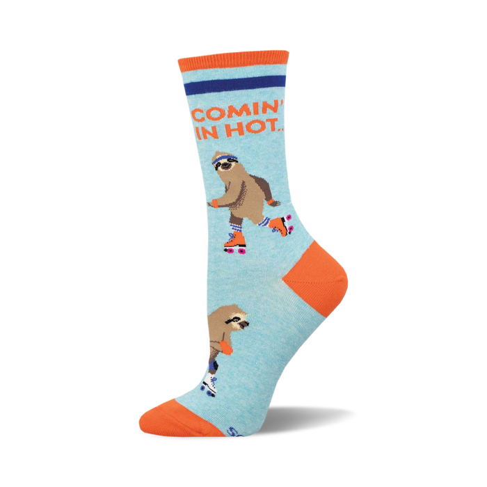 socks that are light blue with an orange toe, heel, and cuff. they have a pattern of sloths on roller skates. the sloths are wearing helmets and knee pads. the text 