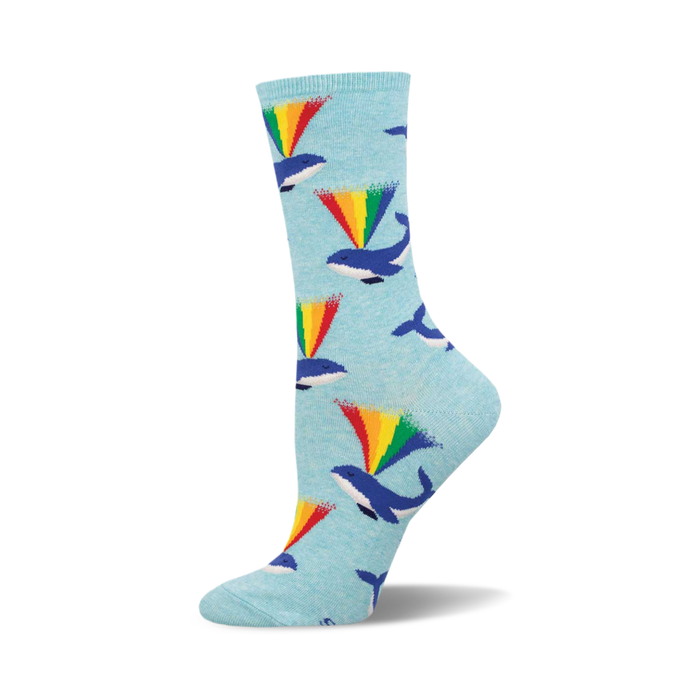 Crew socks in light blue with a pattern of whales spouting rainbows. The main colors are blue, green, yellow, orange, and red. }}