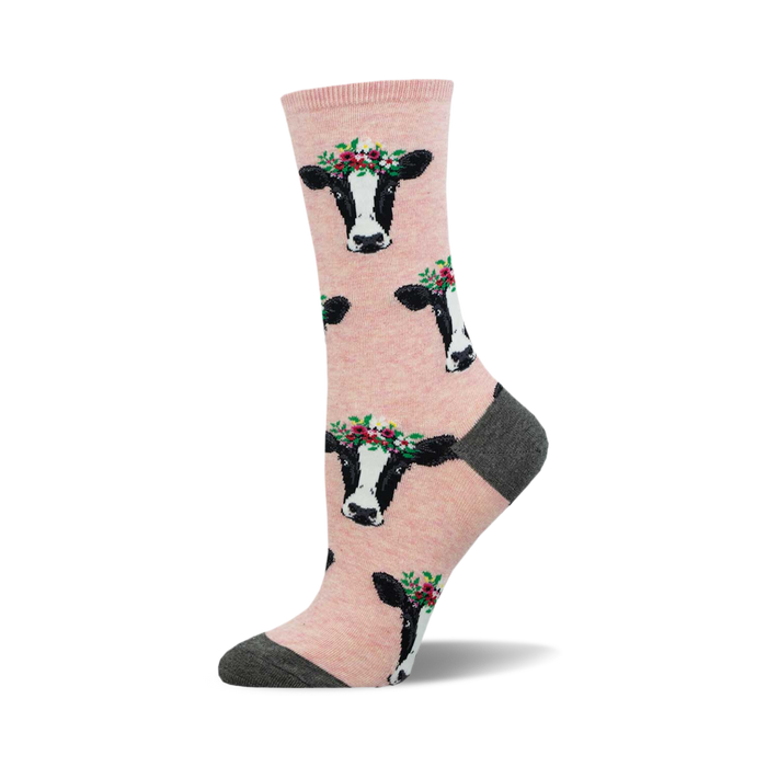 Lifestyle shot of 'Wow Cow' socks on a person's feet, showcasing the socks' light pink color and design.