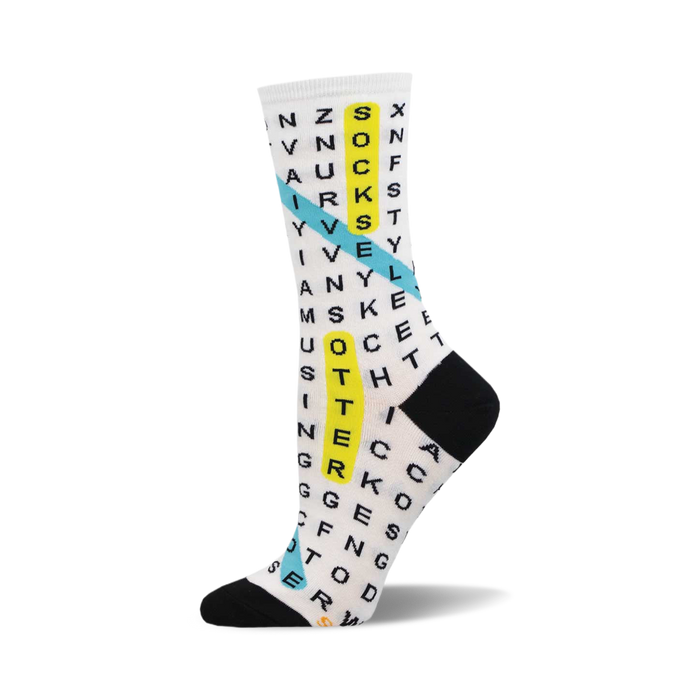 the white socks have a word search puzzle printed in black ink all over. there is a blue and yellow diagonal line going through the word search. the words in the word search are related to the theme of socks. }}