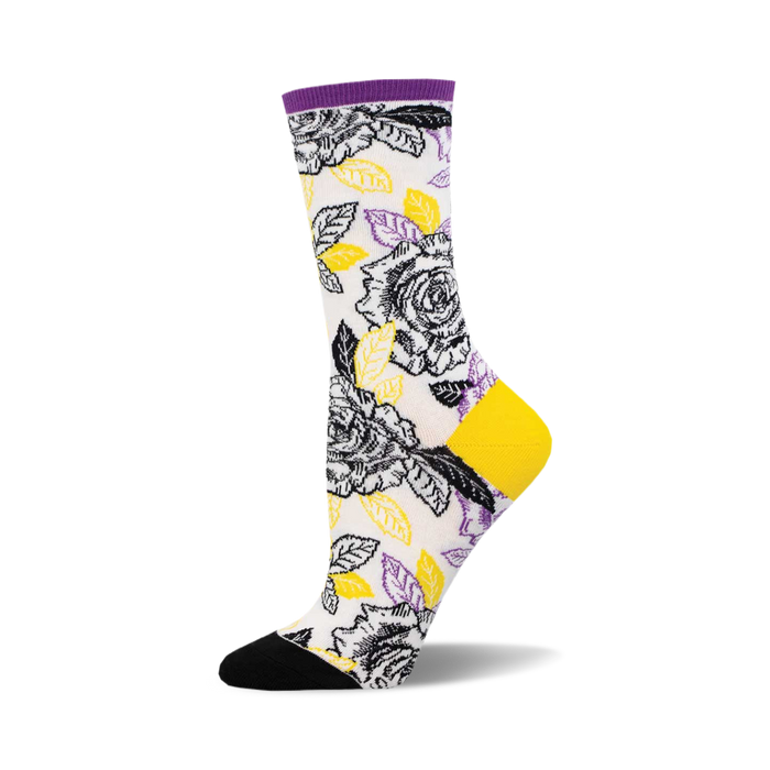 Crew socks with a white background featuring a black and white rose pattern accented with yellow and purple leaves. }}