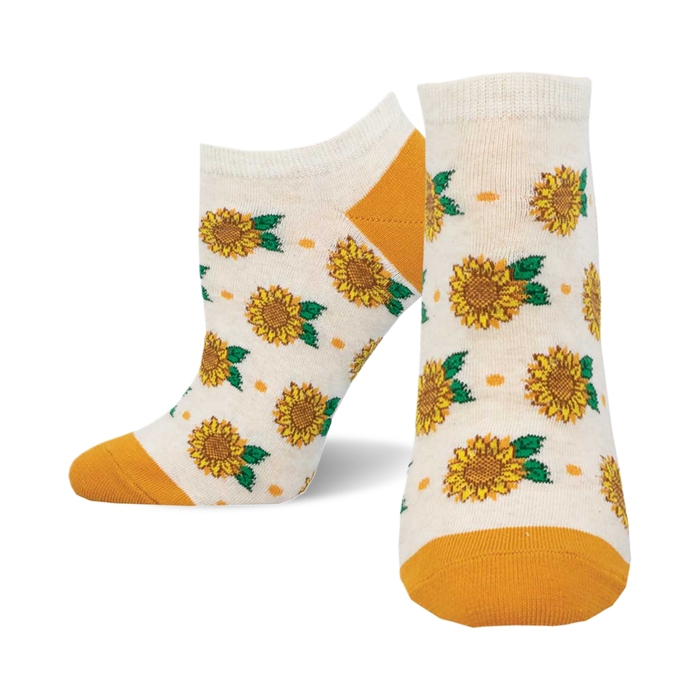 socks that are white with a pattern of sunflowers. the sunflowers are yellow with green leaves. the socks have an orange cuff. }}