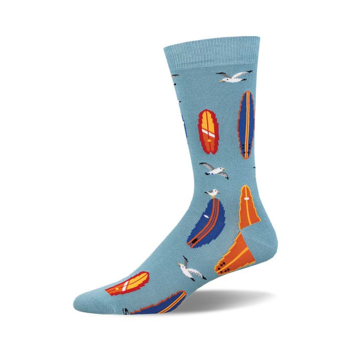 Crew socks in light blue featuring colorful surfboards and seagulls. Perfect for surfers and summer lovers! }}