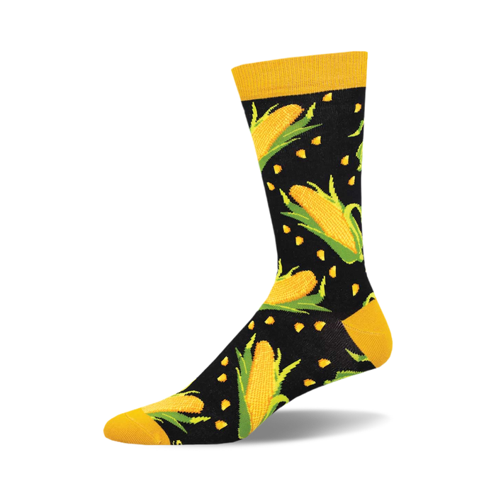 A-Maize-Ing Bamboo crew socks showcasing a whimsical design of yellow corn cobs and green leaves on a black background. Mustard yellow cuffs. }}