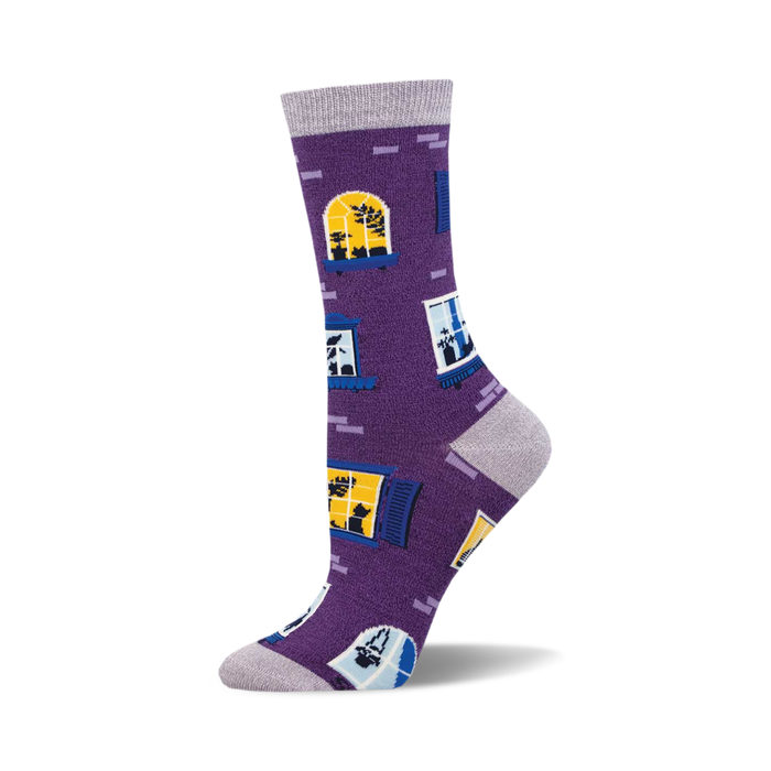 the window cats bamboo socks are purple with a pattern of blue and yellow windows. the windows have cats in them. }}