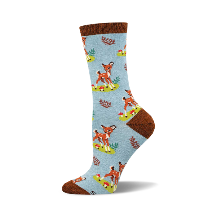 Crew socks in light blue with a repeating pattern of brown fawns, green leaves, and red mushrooms. Brown cuff detail. }}