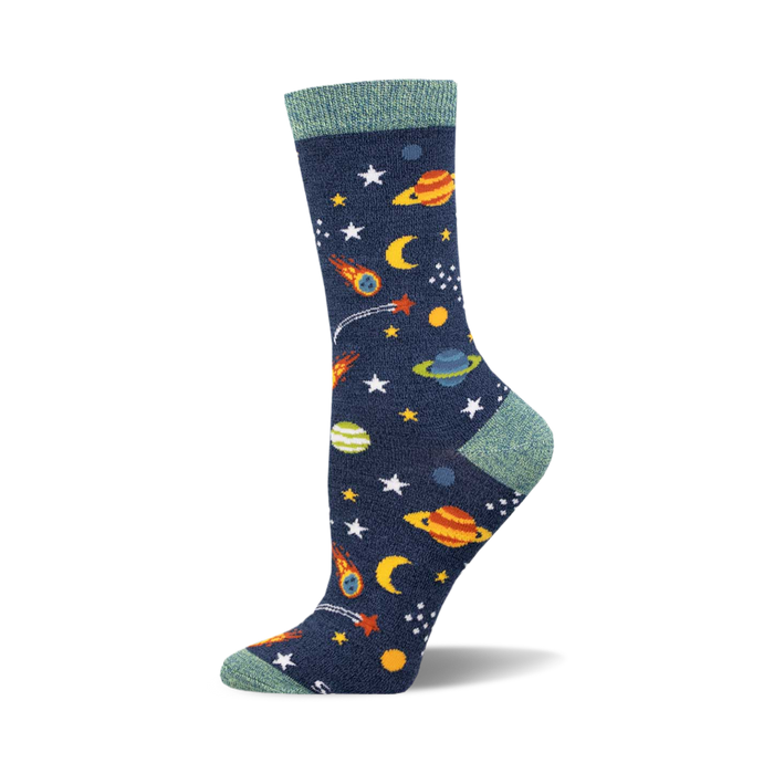 Crew socks in navy blue with colorful planets, stars, and shooting stars. Teal top cuff. Bamboo material. }}