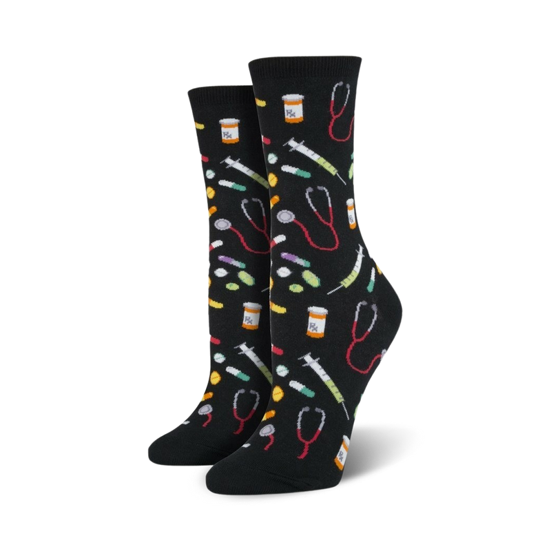 Pair of crew socks in black and blue; colorful pills, syringes, and stethoscopes are playfully scattered across the design.