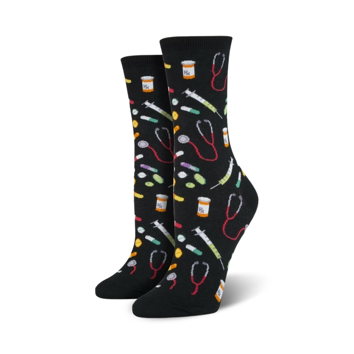 Pair of crew socks in black and blue; colorful pills, syringes, and stethoscopes are playfully scattered across the design.