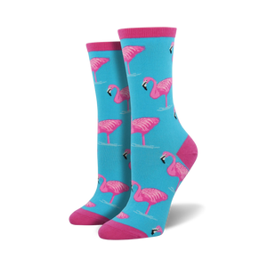 Pair of women's crew socks in teal with a pink flamingo pattern. Pink cuffs.