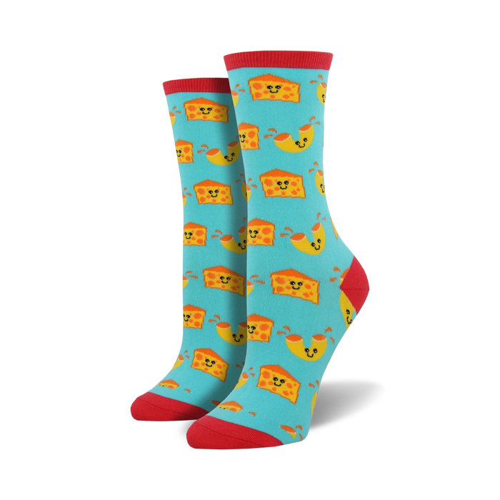 Pair of crew socks with a teal background and repeating pattern of smiling macaroni and cheese pieces. Red cuffs.