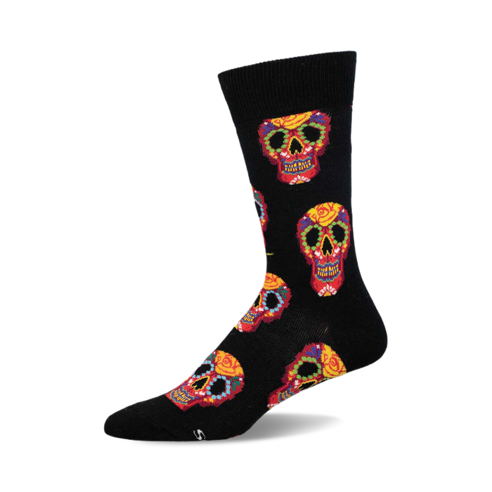 Crew socks in black with a colorful Dia De Los Muertos sugar skull pattern. Red, yellow, and other colors are used for the skull designs. }}