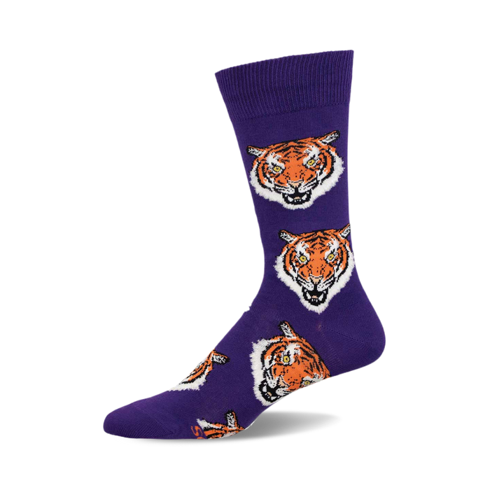 Purple crew socks with a repeating pattern of orange tiger faces. A fun and fierce addition to any outfit! }}