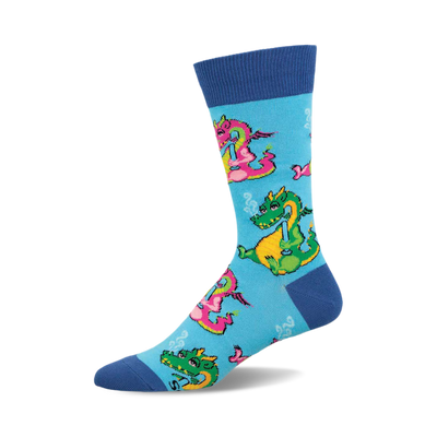 Crew socks in blue with whimsical cartoon dragons smoking pipes. Pink, green, and yellow dragons are featured on a light blue background.
