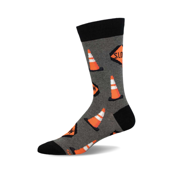 A crew sock in gray with orange traffic cones and 'Slow' signs printed on it. The sock has a black cuff. }}