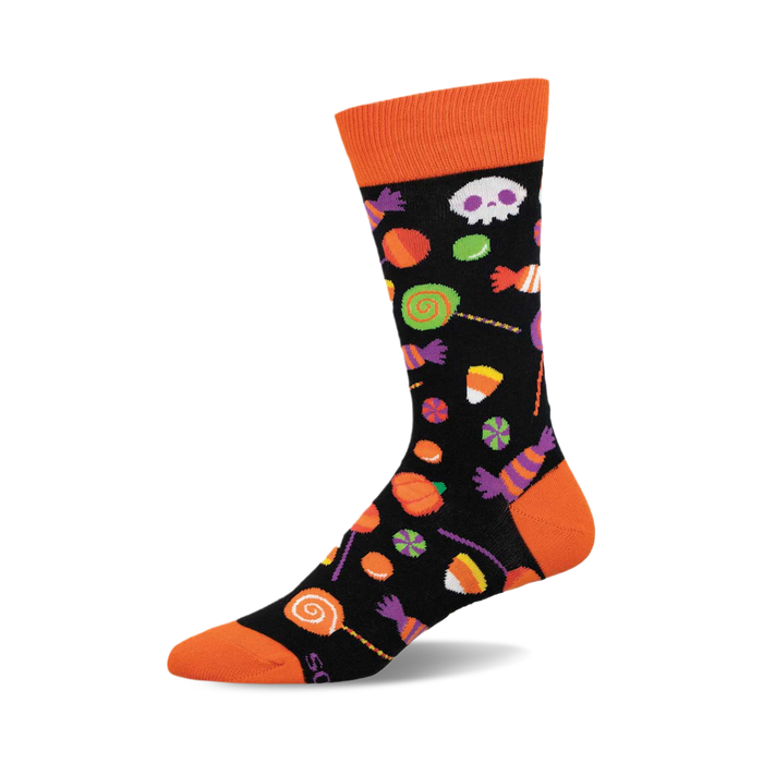 Black crew socks with an orange cuff featuring Halloween candy corn, lollipops, skulls, and other sweets in orange, purple, and green. }}
