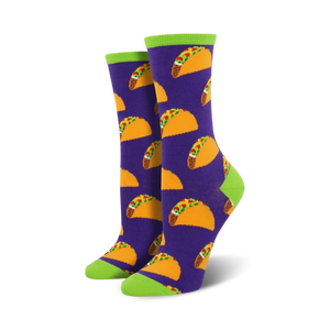 Lifestyle shot of model wearing purple crew socks with a taco pattern and lime green cuffs.