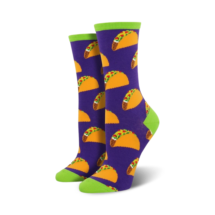Lifestyle shot of model wearing purple crew socks with a taco pattern and lime green cuffs.