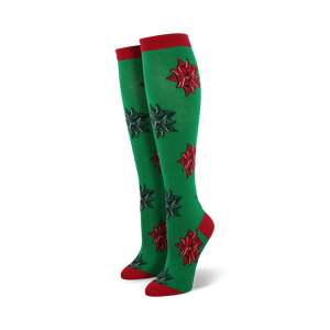 Pair of women's green knee-high socks with red and green Christmas bows. Red cuffs.