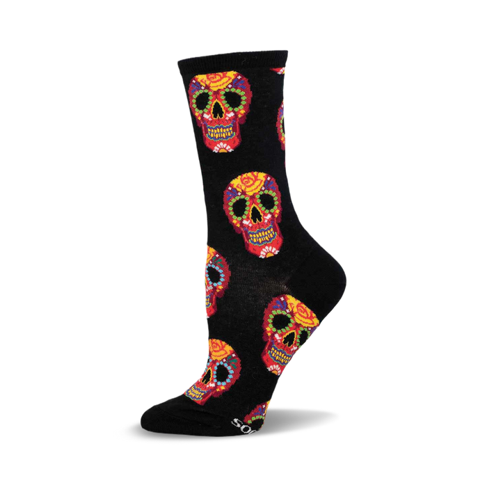 Close-up showing detail of the colorful sugar skull designs on the black socks.