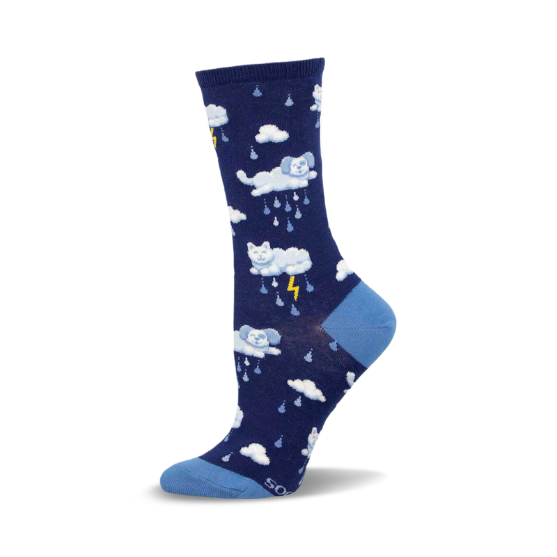 Crew socks in navy blue with a pattern of white clouds, cats, dogs, and lightning bolts. Light blue accents at the toe and cuff.