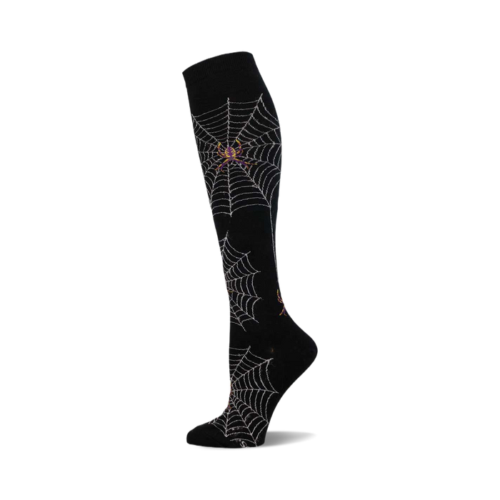 Knee-high socks in black with a silver spiderweb and spider design. A perfect Halloween accessory! }}