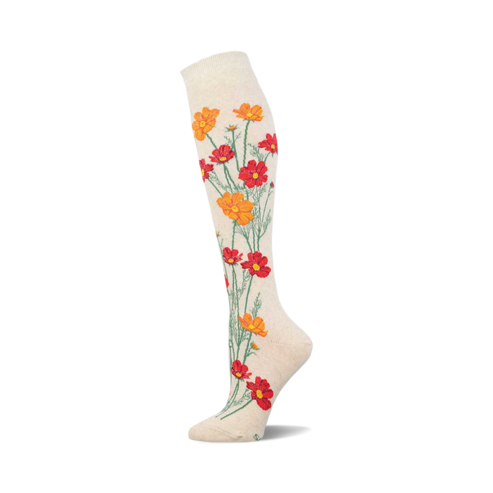 Cream knee-high socks adorned with a whimsical design of orange and red cosmos flowers elegantly arranged along the leg. }}
