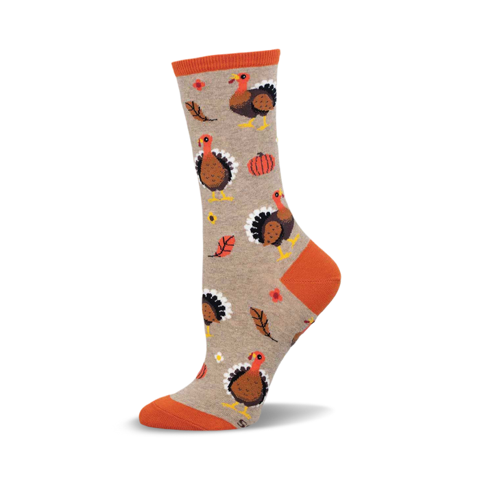 Crew socks in taupe with orange accents. The design includes multiple illustrations of turkeys, pumpkins, and leaves. }}