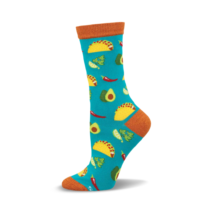 Crew socks in teal with a fun taco-themed design. Features yellow tacos, green avocados, red chilies, and lime wedges. }}