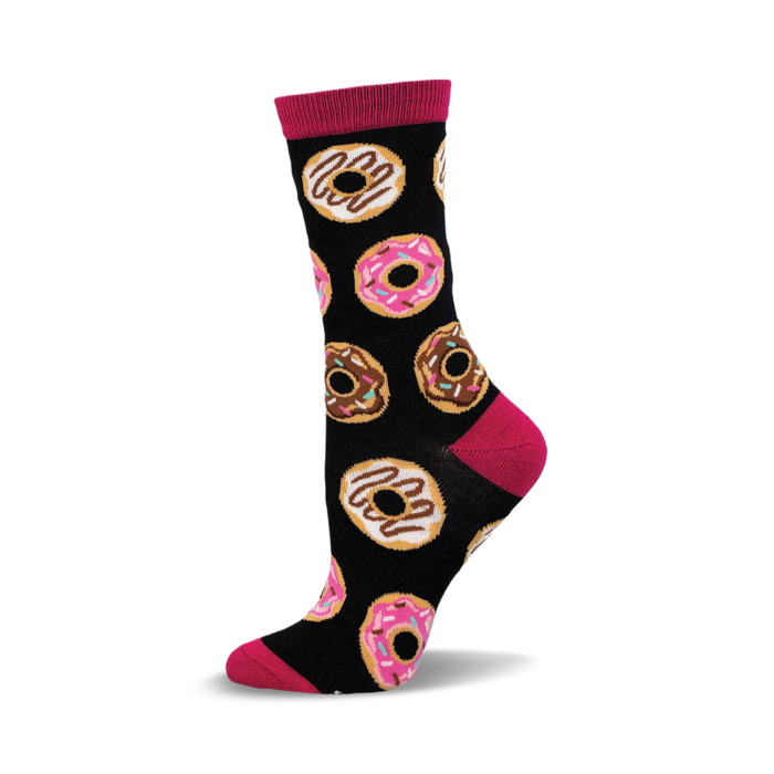 A black crew sock with pink and brown donut designs. The sock has a fuchsia cuff and is made of bamboo. }}