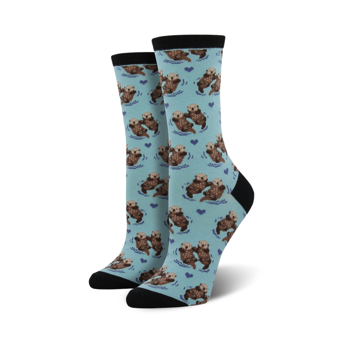 Close-up of a pair of black-cuffed otter socks against a white background.
