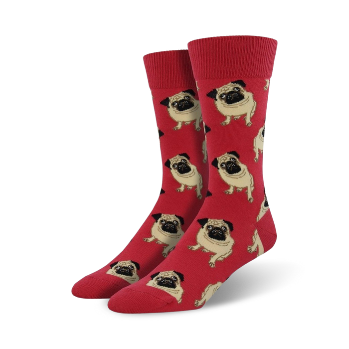 Close-up of red crew socks featuring a pattern of pugs. Fun and colorful!