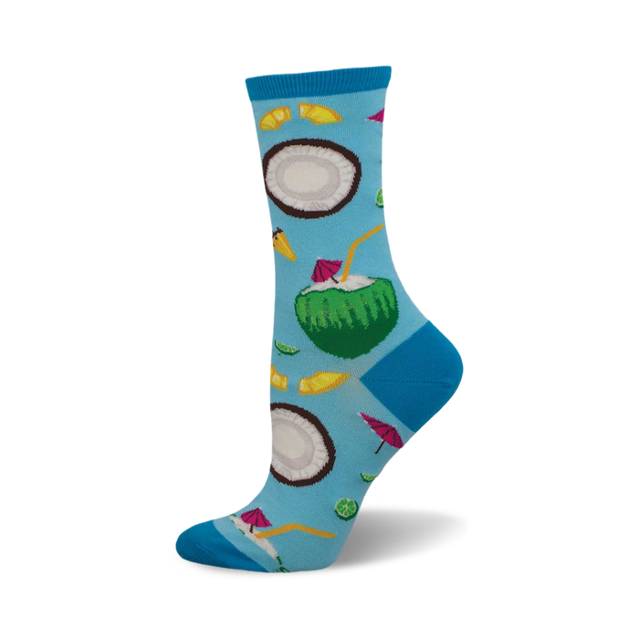 Crew socks showcasing a tropical design. Light blue background with coconuts, limes, and cocktail umbrellas. Fun and colorful. }}