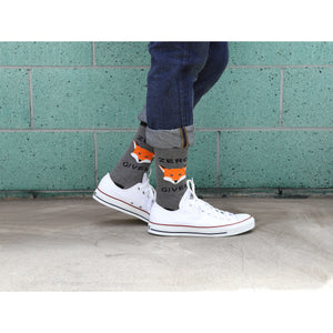 Lifestyle shot showing a person wearing the Zero Fox Given socks with jeans and white Converse sneakers.
