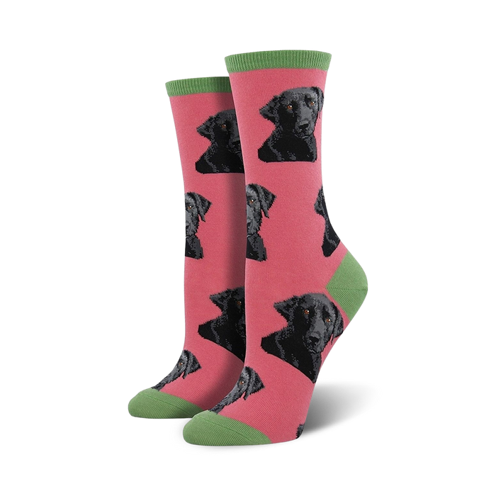 Pair of women's crew socks. Pink background with repeating black Labrador Retriever faces. Green cuffs. }}