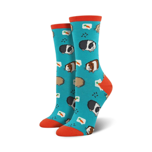 blue crew socks with orange toes and heels featuring a pattern of cartoon guinea pigs wearing speech bubbles with carrots.  