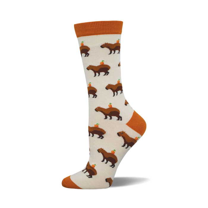 Cream crew socks with brown capybaras and small orange circles on them. Orange cuffs. }}