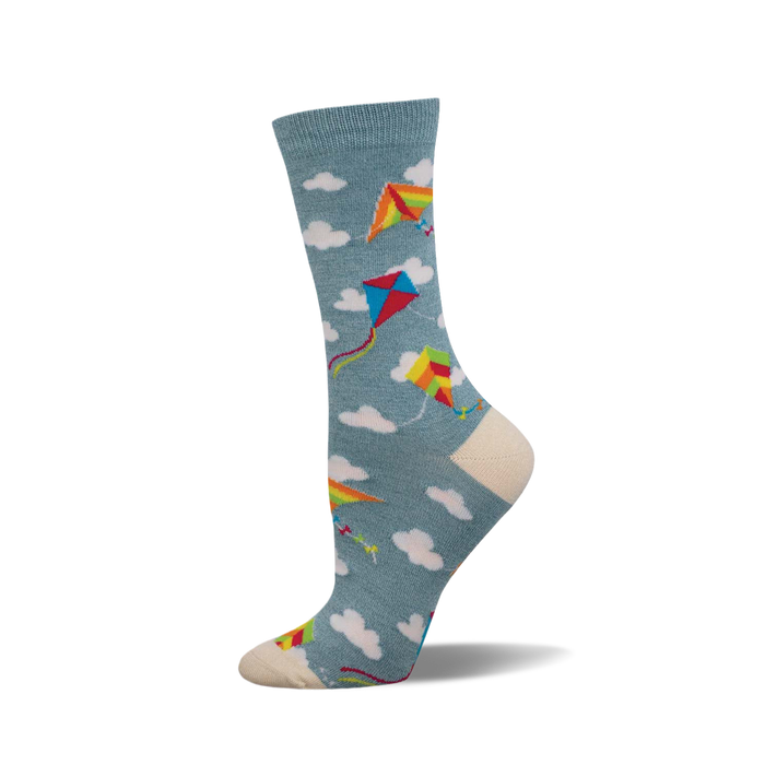 A side view of a crew sock in teal with colorful kites and white clouds. The toe and heel are off-white. }}