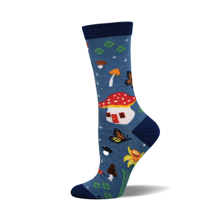 Blue crew socks featuring a red and white mushroom house, orange and brown mushrooms, yellow butterflies, and yellow flowers. }}