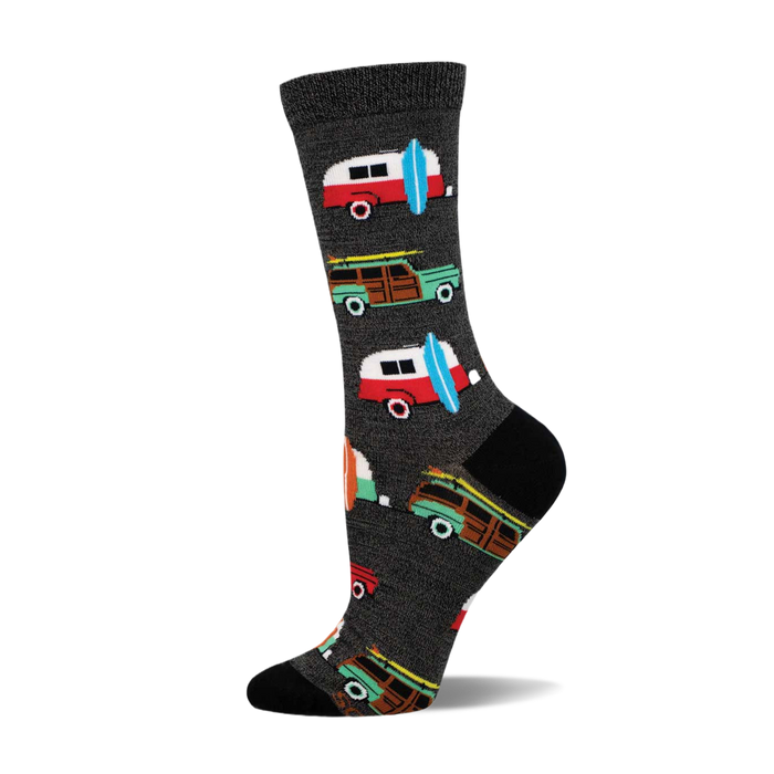 A side view of a crew sock with a dark grey background and colorful illustrations of vintage station wagons and surfboards. }}