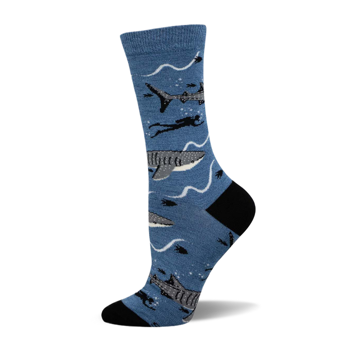 Crew socks in blue featuring whale sharks, divers, and wavy lines. Black heel and toe. }}