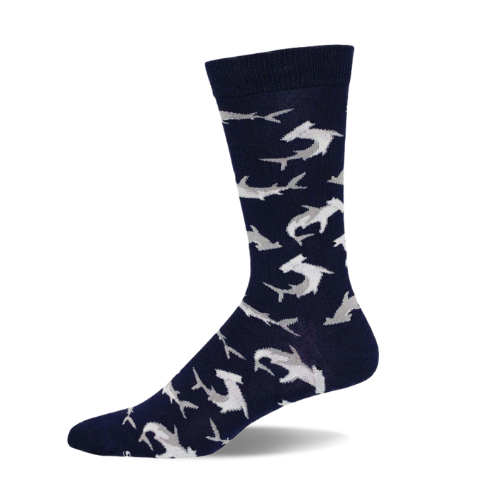 A navy blue crew sock with a pattern of light gray hammerhead sharks. The sock is shown from the side, highlighting its design and comfortable fit. }}